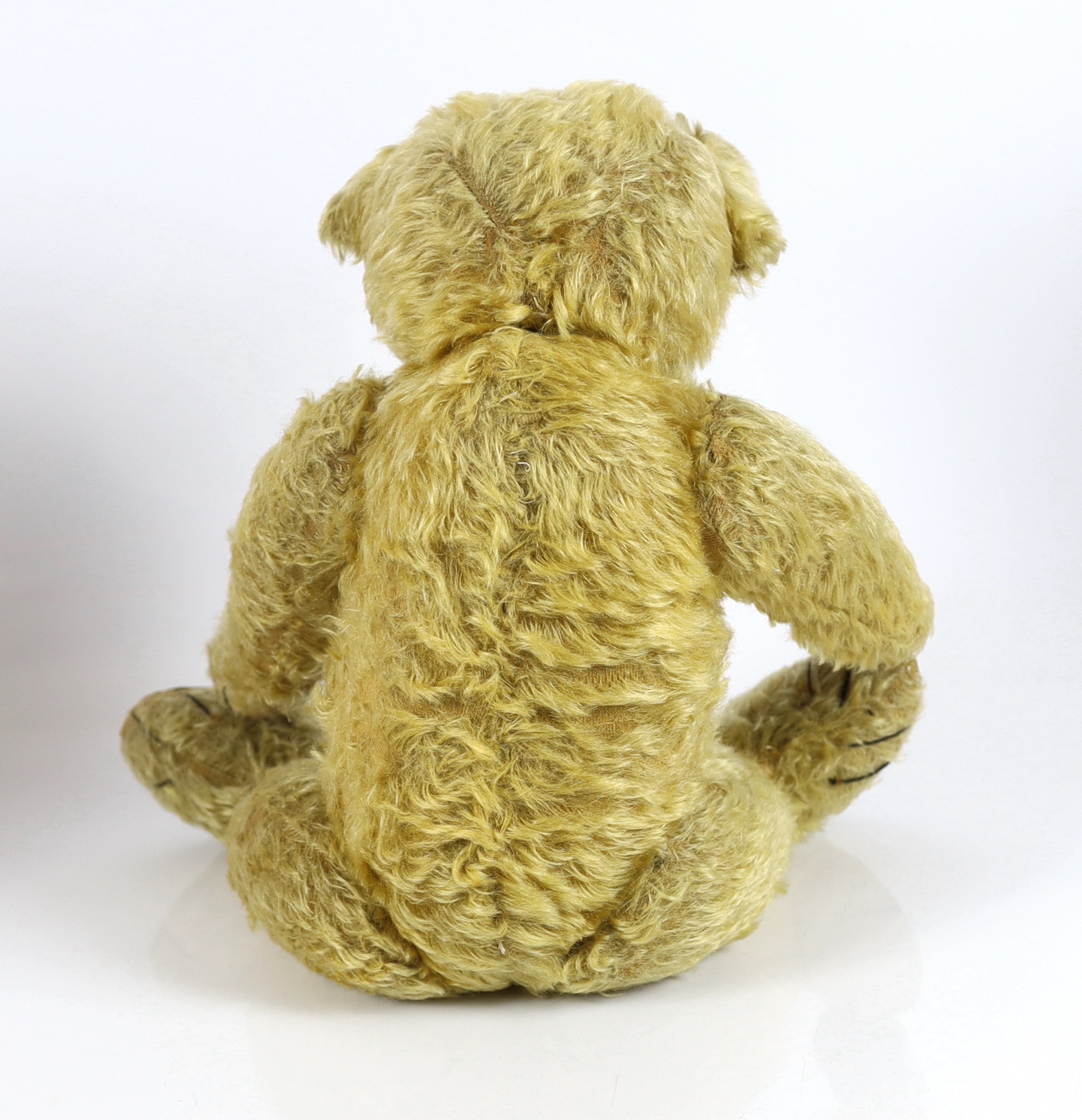 A large 1930's Chiltern bear, 53cm, with replaced nose stitching, some hair loss generally